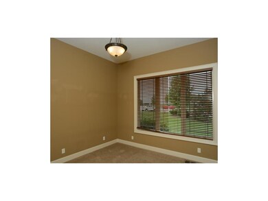 1st floor 2nd bedroom with carpet and wood blinds