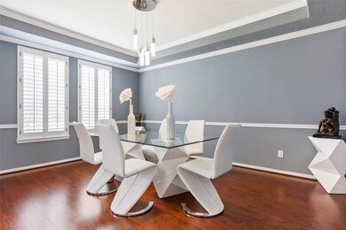 The formal dining room has a coffered ceiling, dimmable lighting and can easily accommodate a large table and buffet.