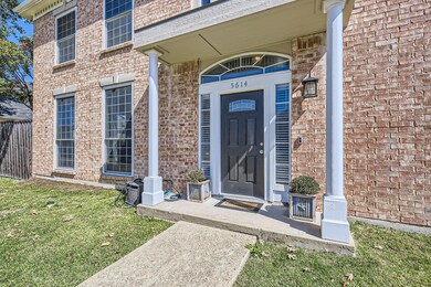 View of exterior entry with a lawn