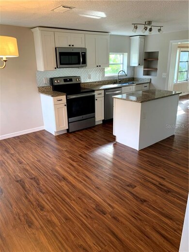 Kitchen with Beautiful Flooring and All Appliances