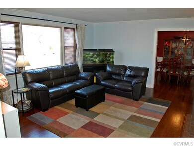 Living room with huge picture window, fireplace an