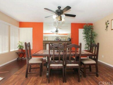 Family room with fireplace, being used as dinning 