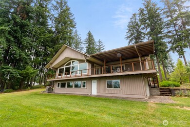 This home features a light-filled daylight basement and expansive windows on main levels, creating a bright, airy feel throughout the home. Step out onto the covered deck and take in the peaceful surroundings—perfect for year-round enjoyment.