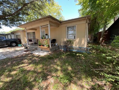 Rear view of house with covered porch