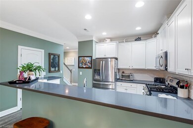 Plenty of counter space and bar for extra seating or great for entertaining.