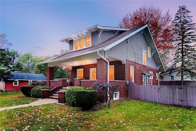 View of front of home featuring a yard and a porch