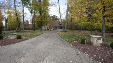 The exposed aggregate concrete driveway with light