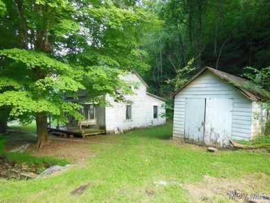 Side view shows the detached garage (used for stor