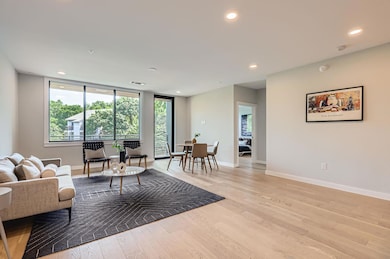 Living area with light wood finished floors, base
