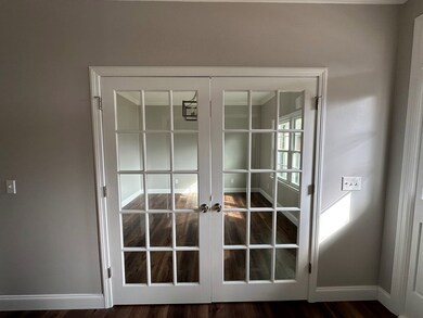 Glass doors leading into sitting/formal living roo