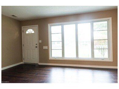The living room is refreshingly bright and feature