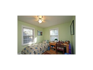Lots of nice light in guest bedroom. Hardwood floo
