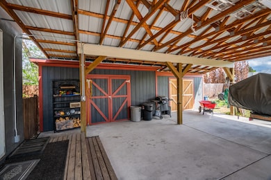 Carport with 2 Storage Sheds
