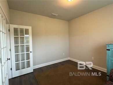Spare room featuring dark hardwood / wood-style flooring