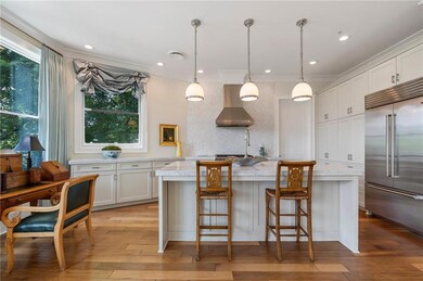 Chef's kitchen with top of the line appliances and upgraded marble countertops
