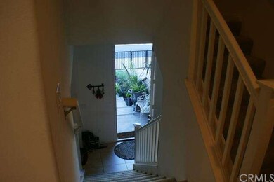 Second level looking down and stairs going up to t
