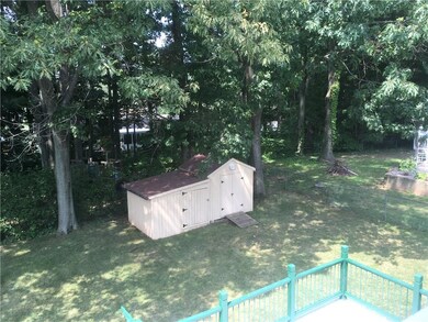 Back yard with storage shed.