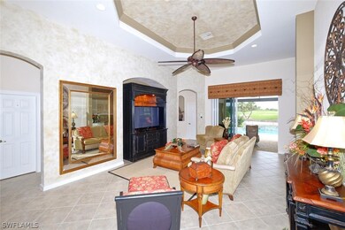 Great room has trey ceiling, tile floors on the di