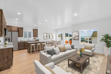 Living area featuring light wood-style flooring and recessed lighting