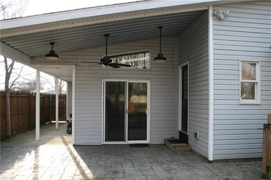 Stamped concrete patio with cover and ceiling fan 