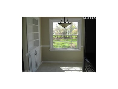 Pictured is the eating space in the kitchen with b