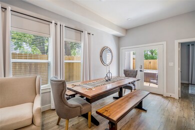 The Dining Room has wrap around windows and the patio door leading to the backyard oasis.