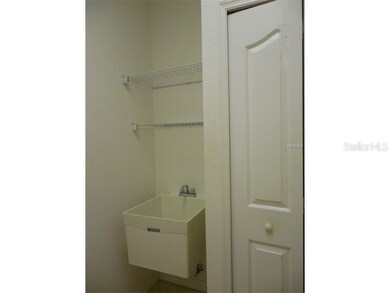 UTILITY TUB AND PANTRY IN LAUNDRY ROOM