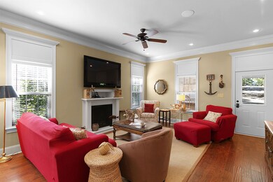 Beautifully decorated living room flowing into an 