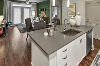 Kitchen with white cabinetry, a center island with