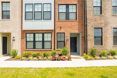 Doorway to property featuring brick siding