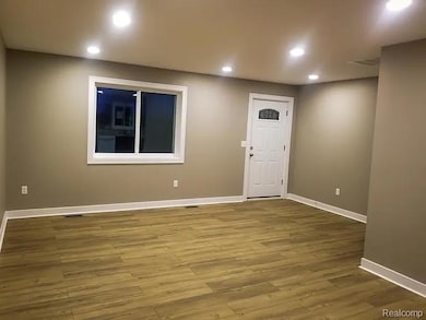Entrance foyer featuring recessed lighting and wood finished floors