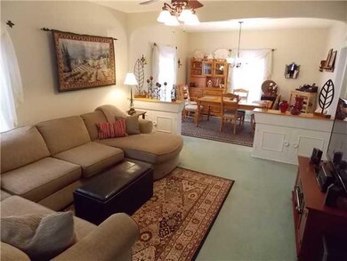 Living Room. The living room opens to the formal d