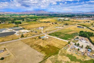 Aerial view of property's location featuring a water and mountain view