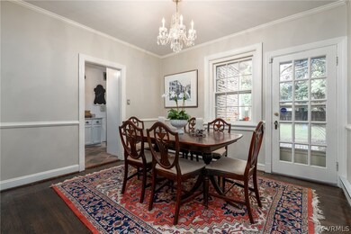 Dining room with chair rail and french door to patio