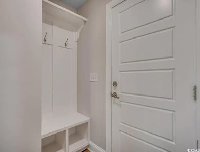 Mudroom featuring baseboards