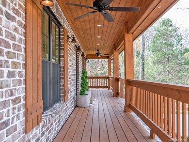 Sprawling front porch with recessed lighting and c