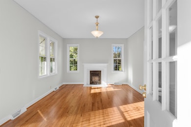 Unfurnished living room with hardwood / wood-style