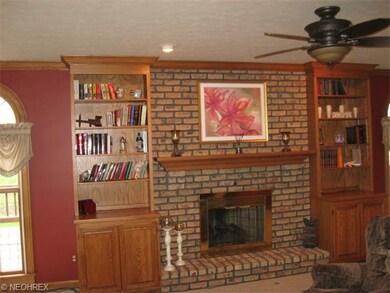 Family room's brick hearth/mantel--Lovely Built-in
