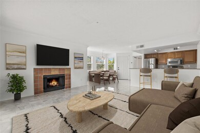Virtually Staged Living Area. This layout showcases the inviting potential of the open living space, complete with a cozy fireplace and abundant natural light.