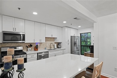 Open concept with peninsula/breakfast bar