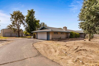 Paved driveway and side of home