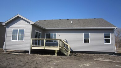Rear view, sliding door to deck.
