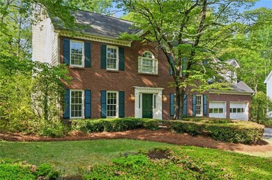 Colonial inspired home with roof with shingles, a 