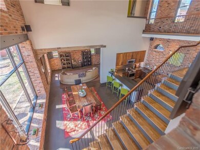 View into living space from mid level master suite