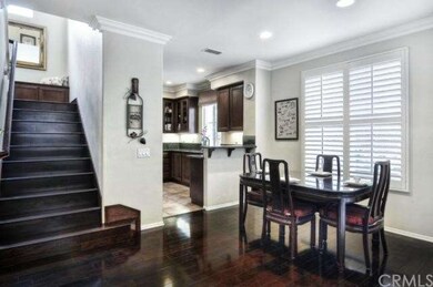 Beautiful wood stairs too. Dining & kitchen with c