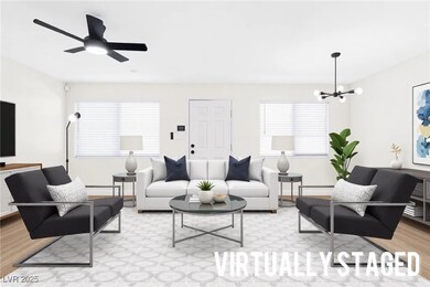 Living room with baseboards, light wood finished f
