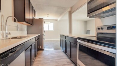 Sleek kitchen features new Quartz counters, new ca