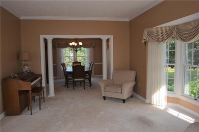 Formal living room also boasts a gorgeous bay wind