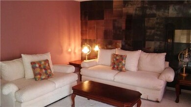 Spacious living room w/ plush carpet