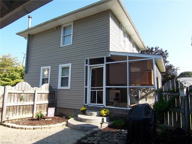 Cozy screened back porch.  Nicely landscaped area.